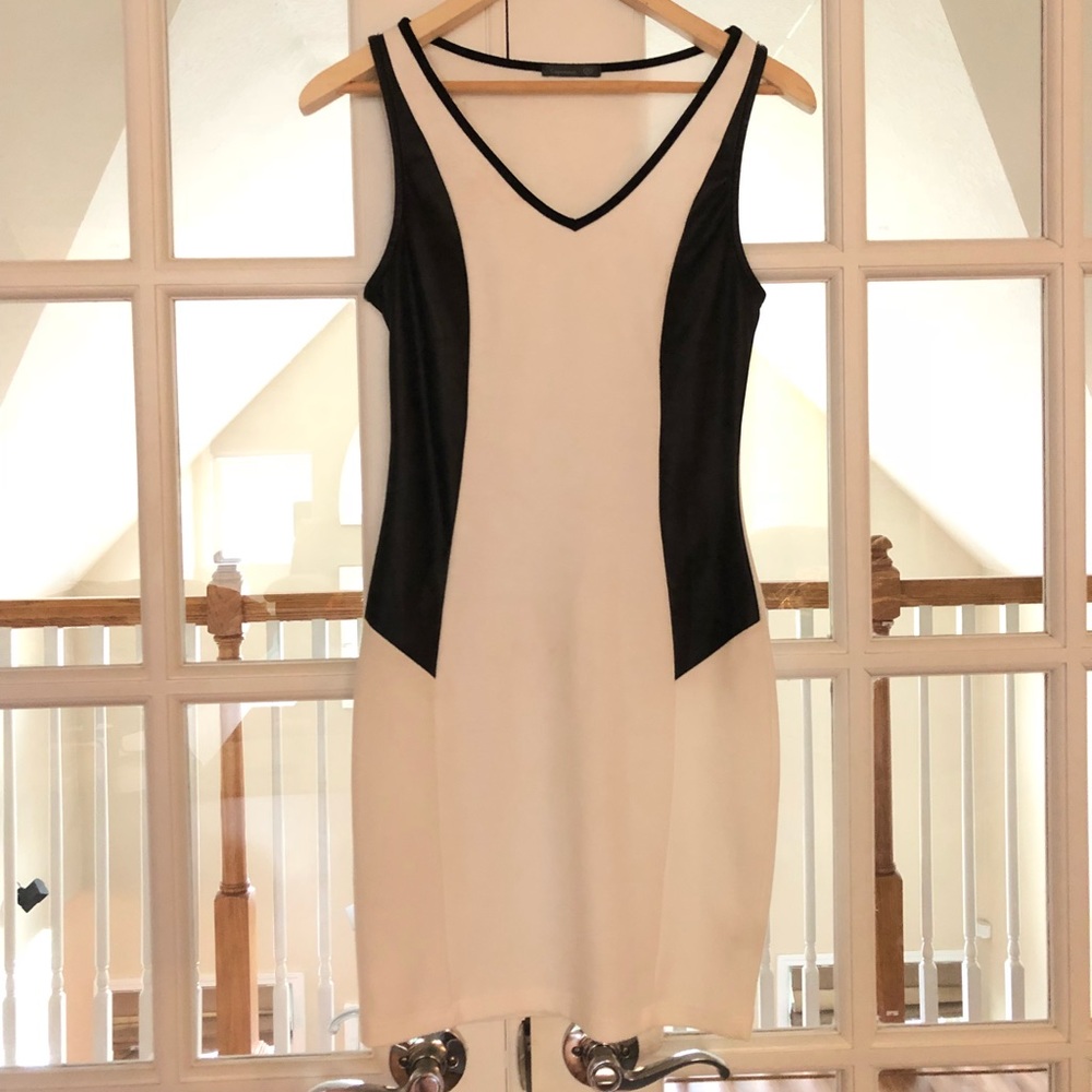 White mini dress with black pleather detail.